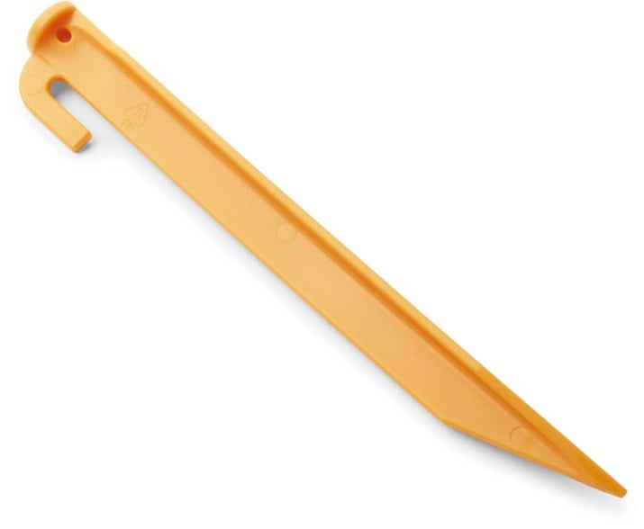9-inch eco-friendly tent peg in use on a camping site with a tent anchored firmly in place.