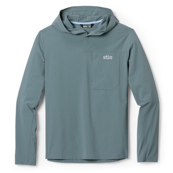 Front view of men's performance hoodie shown on rocky trail, highlighting lightweight woven fabric and chest pocket.