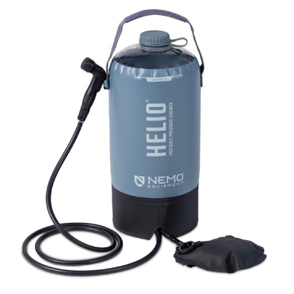 NEMO Helio pressure shower showing the foot pump and hose setup.