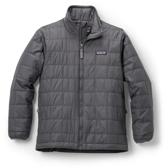 Patagonia kids Nano Puff jacket in use during a winter hike, showcasing its windproof design.