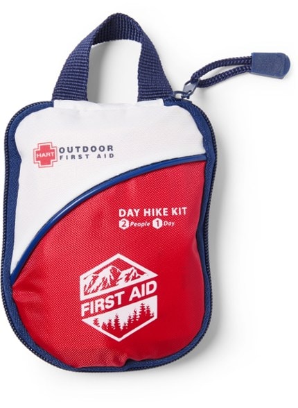 Compact outdoor first aid kit showing labeled pockets and contents for hiking emergencies