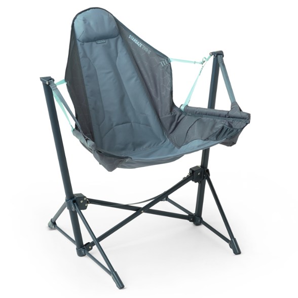 Stargaze Evo-X Folding Reclining Camp Chair with cup holders in a park setting.