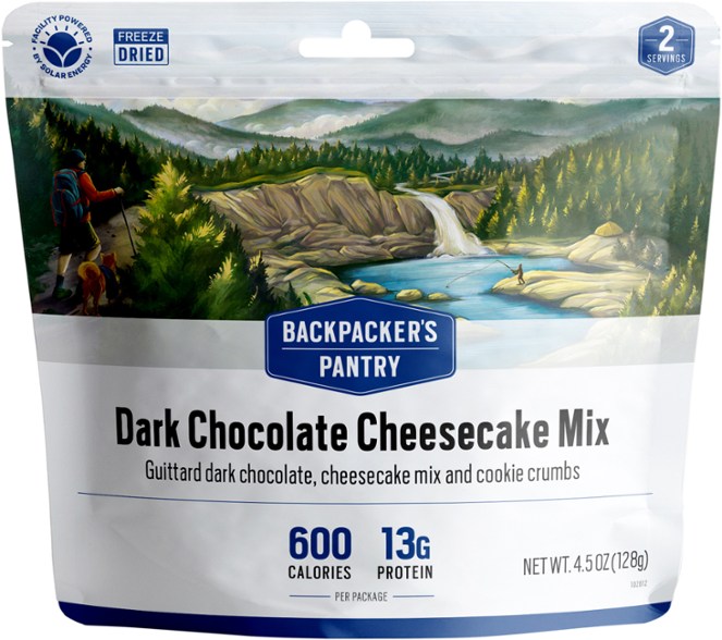 Front view of packaged TrailTreat dark chocolate cheesecake mix outdoors on a campsite table