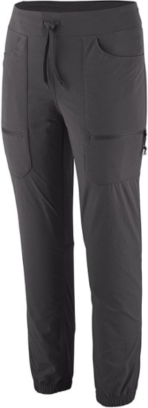 Patagonia Quandary joggers in action on a hiking trail, emphasizing their stretch-fit and mobility.