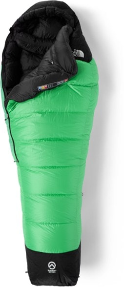 North Face Summit 0°F sleeping bag displayed outdoors with snowy mountains in the background, highlighting its warm features.