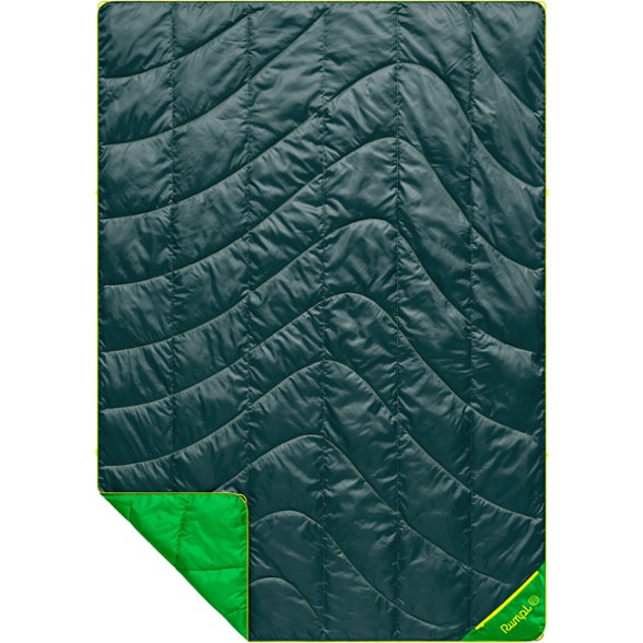Eco-Friendly Adventure Blanket in a scenic mountain setting, showcasing its packable design.