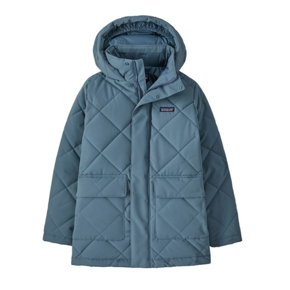 Patagonia kids insulated jacket showcased in a winter landscape, highlighting its water-resistant qualities.