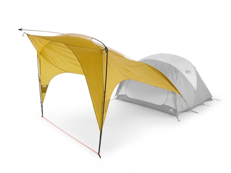 REI Co-op Base Camp Vehicle Connector set up next to a car, showcasing its spacious interior.