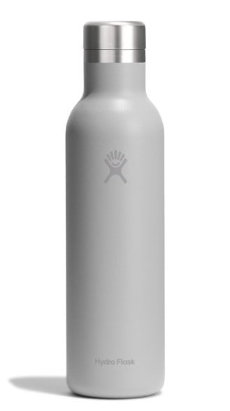 Hydro Flask Wine Bottle displayed outdoors with a picnic setup, showcasing its sleek design and ceramic lining.