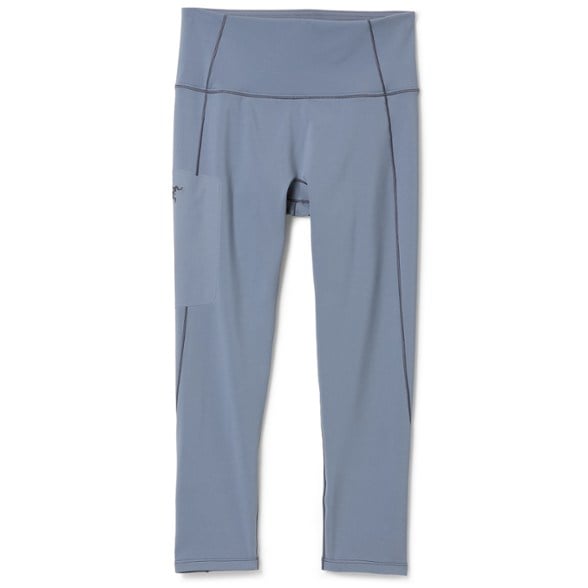 Rho Boot Cut Women's Base Layer Pants in snowy mountain terrain, showcasing their comfort and fit.