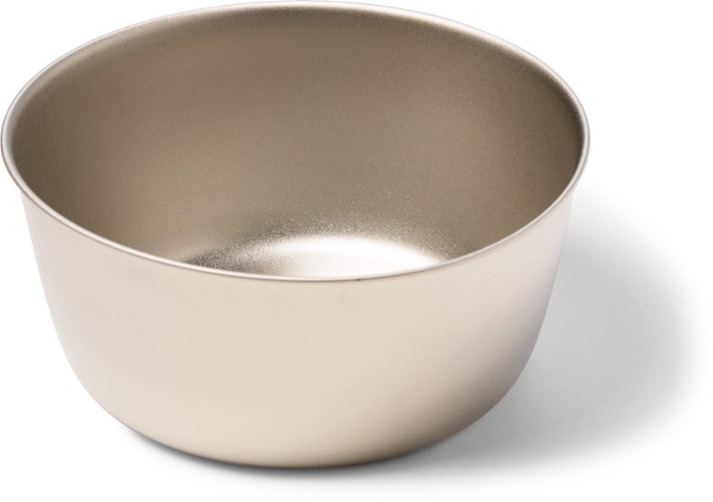 Close-up of the ultra-light titanium camping bowl, showcasing its sleek design and lightweight nature.