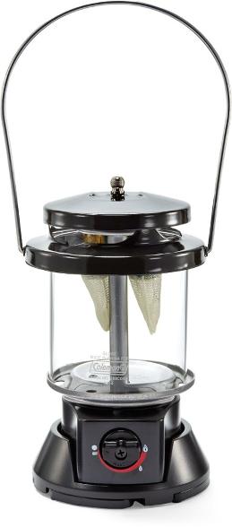 Coleman propane lantern in use at a campsite, illuminating the area