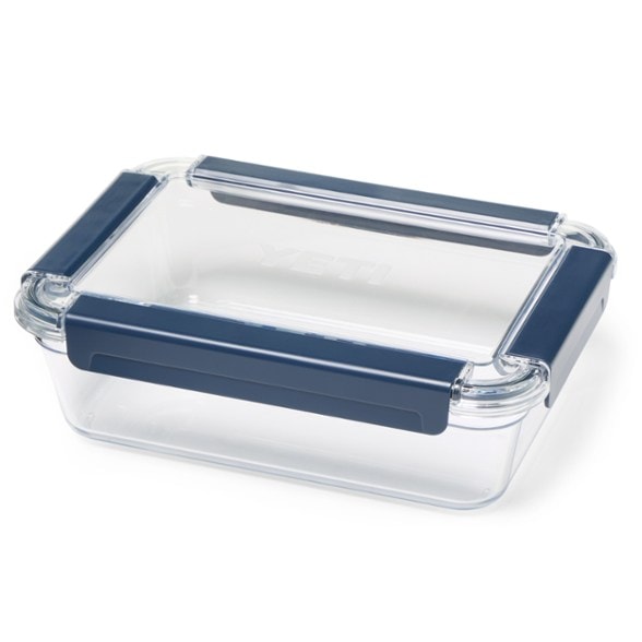 YETI large airtight food storage container in a camping setup, showcasing its durability and size.