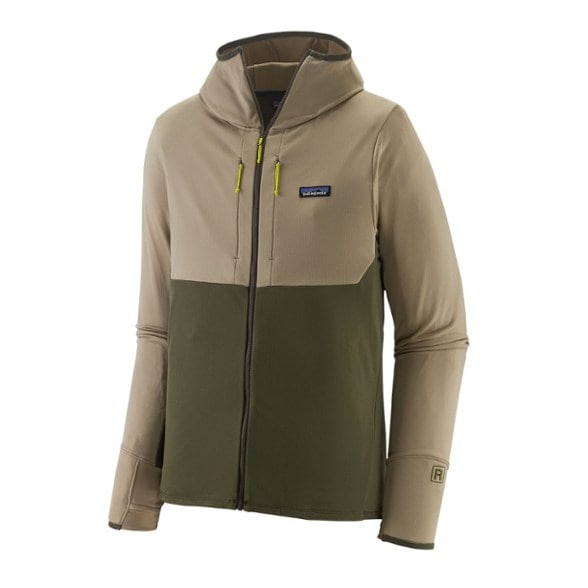 Patagonia R1 thermal hoody on a hiking trail showcasing its durability against the elements.