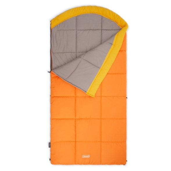 Eco-friendly big and tall sleeping bag in a camping setting, showcasing warmth and comfort for cold weather.