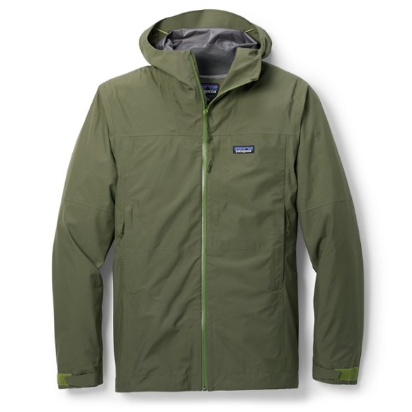 Patagonia Boulder Fork rain jacket in action on a hiking trail during rain.