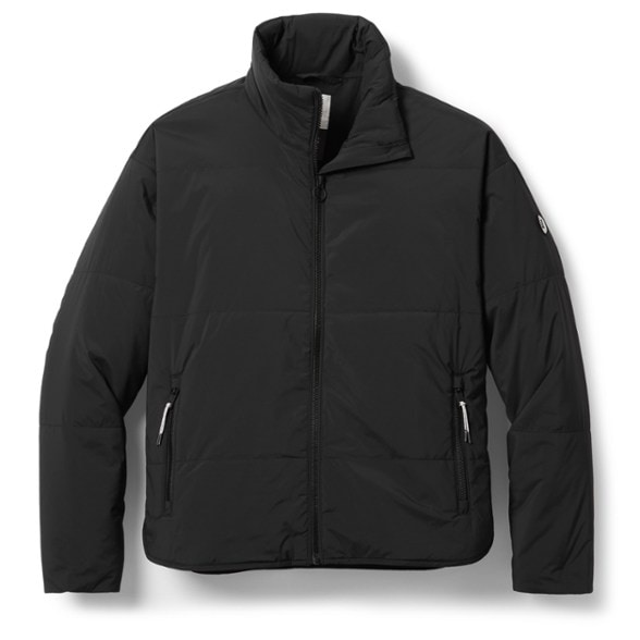 Front view of women's insulated jacket worn on a forest hike