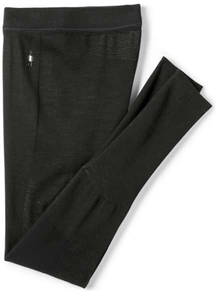 Men's merino wool thermal leggings displayed on a snowy mountain background, showcasing their flexibility and comfort.