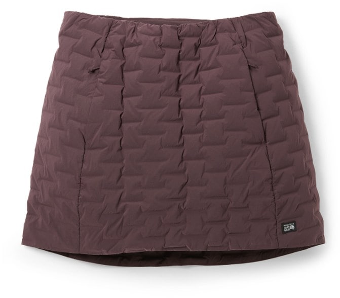 Mountain Hardwear insulated skirt displayed on a model during a hike, showcasing warmth and style.