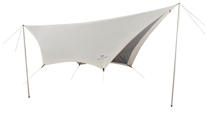 Takibi Hexa tarp with fire pit setup in a forest.