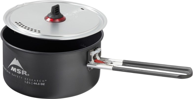 Lightweight ceramic solo cooking pot angled to show durable nonstick surface and removable handle, perfect for backpacking cookware