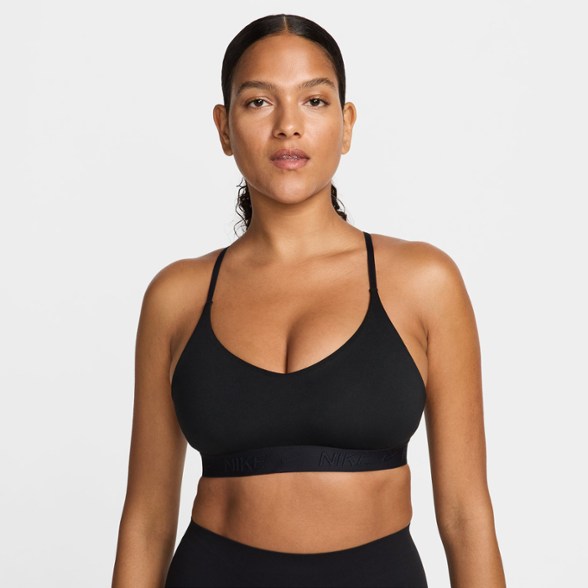 Front view of Nike Indy Essential light support bra showcasing sleek racerback design, ideal for women's activewear