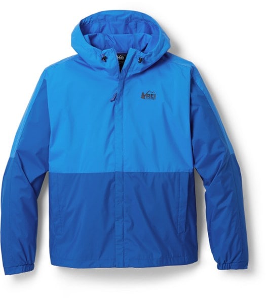 Trailblazer Men's Waterproof Jacket displayed on a hiking trail under rainy conditions, showcasing its waterproof capabilities.