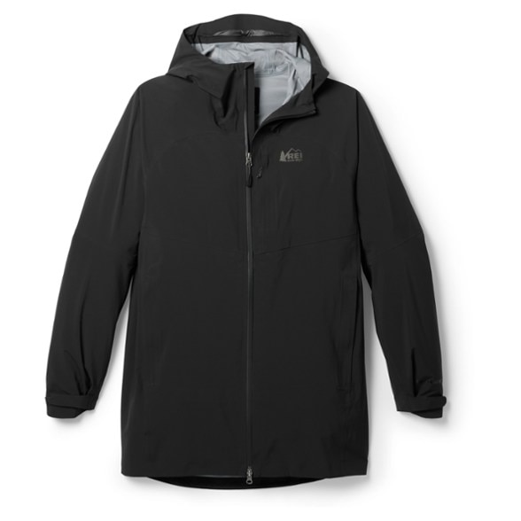 Men's XeroCloud 3L Long Waterproof Hiking Jacket showcasing its waterproof features in a forest.