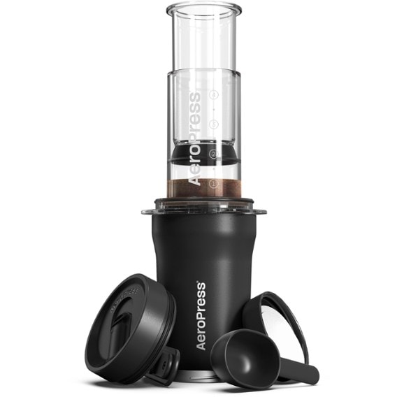 Close-up of AeroPress Go Plus brewing into the insulated tumbler on a campsite table