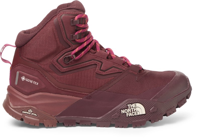 Side view of Trailblazer Women's GORE-TEX Hiking Boots in action on a rocky trail.