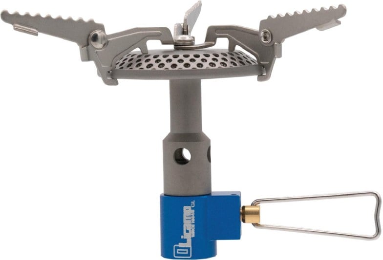 Kinetic Ultra Titanium Stove with pot supports during a camping setup.