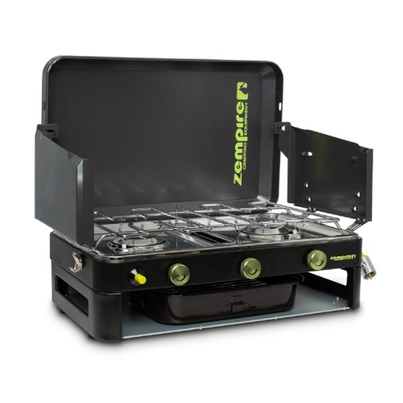 Zempire Dual-Burner Camping Grill Stove with flames on burners at a campsite