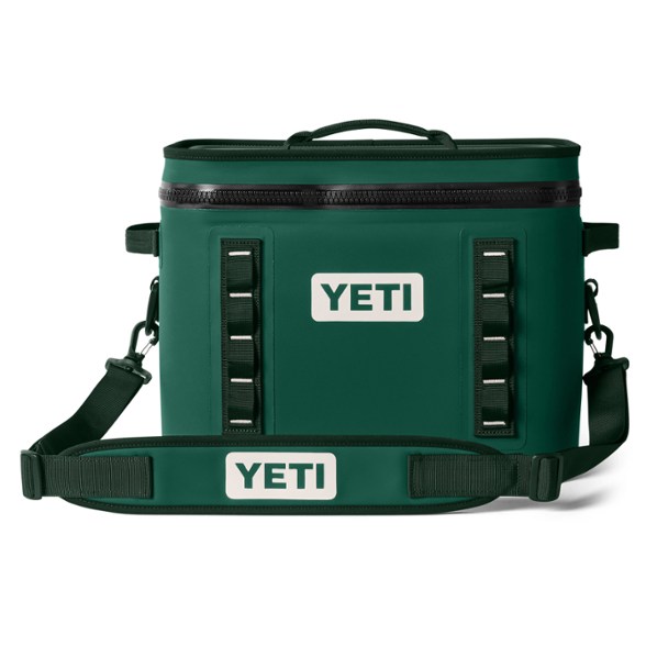 YETI Hopper Flip 18 soft cooler in a camping setting, showcasing its durable exterior.