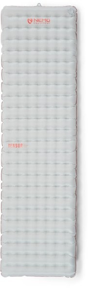 NEMO Tensor insulated pad in a camping setup showing stability and insulation features.