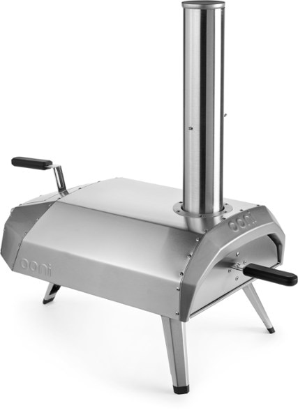 Karu 12 Multi-Fuel Pizza Oven with wood and charcoal, demonstrating its versatility for outdoor cooking.