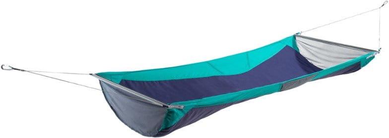 Top-down view of SkyNest hammock setup at a forest campsite, highlighting integrated pillow in sleeping mode.