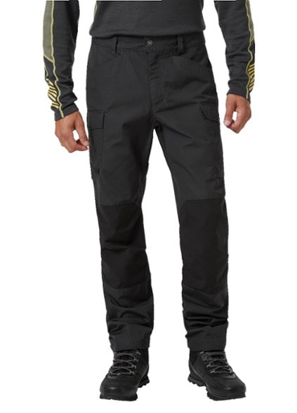 Vandre Tur men's hiking pants on a rocky trail, highlighting cargo pockets