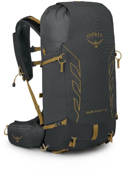Osprey Talon Velocity 30 backpack viewed from the side, showcasing the flexible back panel and hydration sleeve.