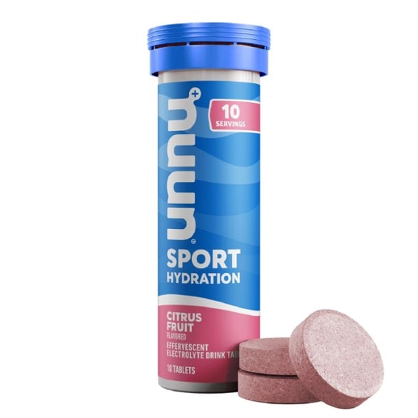 Close-up of Nuun Sport+ electrolyte tablets dissolving in water for sports hydration
