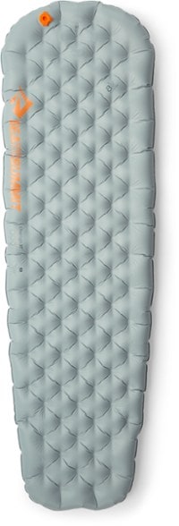Side view of the sleeping pad showing 4-inch thickness and mummy shape for thermal efficiency.