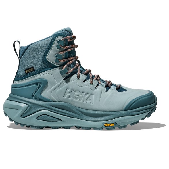 HOKA Kaha 3 GTX Women's Hiking Boots shown on rocky terrain, highlighting waterproof design.