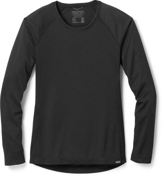 Patagonia Women's Midweight Capilene Crew Base Layer Top showcasing its moisture-wicking fabric during a run.
