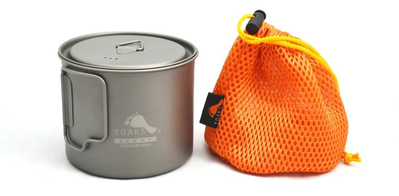 TrailTitan™ titanium pot shown from top angle with lid partially open, displaying ounce/milliliter markings