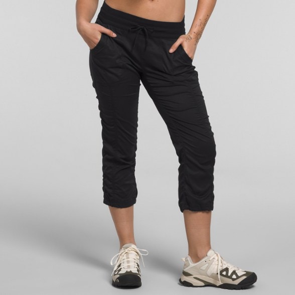 Front view of women's hiking capri pants showing stretch fabric and adjustable waistband