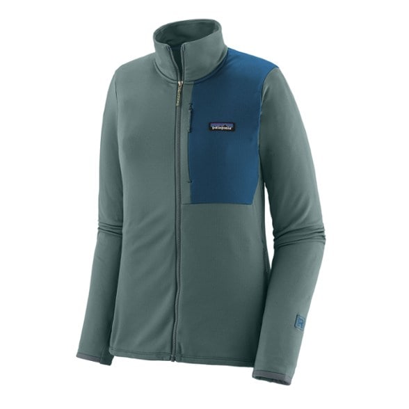 Front view of the women's fleece jacket showcasing its slim alpine fit and zippered hand pockets for active wear.