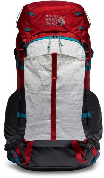 Mountain Hardwear AMG 75 pack in action on a rugged mountain trail, showcasing its durability and functionality.