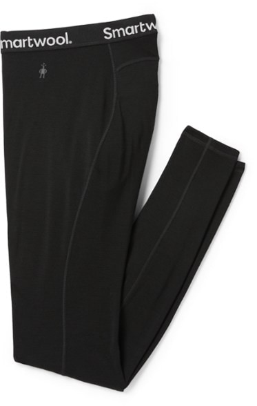 Men's merino wool thermal base layer bottoms in action on the slopes.