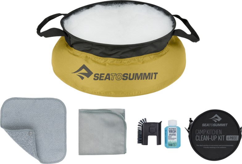 Compact camping clean-up kit showing pot scrubber, washcloths, and portable dishwashing kit in nylon zip pouch