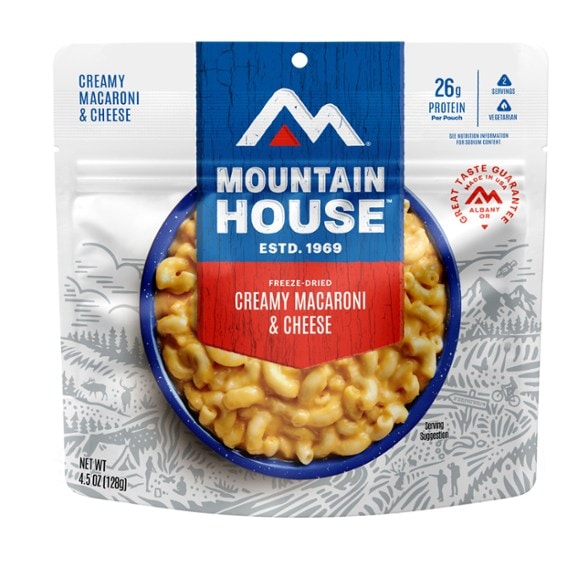 Creamy macaroni and cheese prepared in the wilderness, showcasing the meal's rich texture.