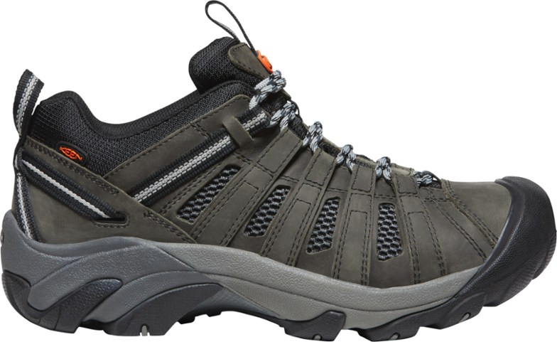 Side view of KEEN Voyageur Men's hiking shoes highlighting breathable mesh and durable leather.